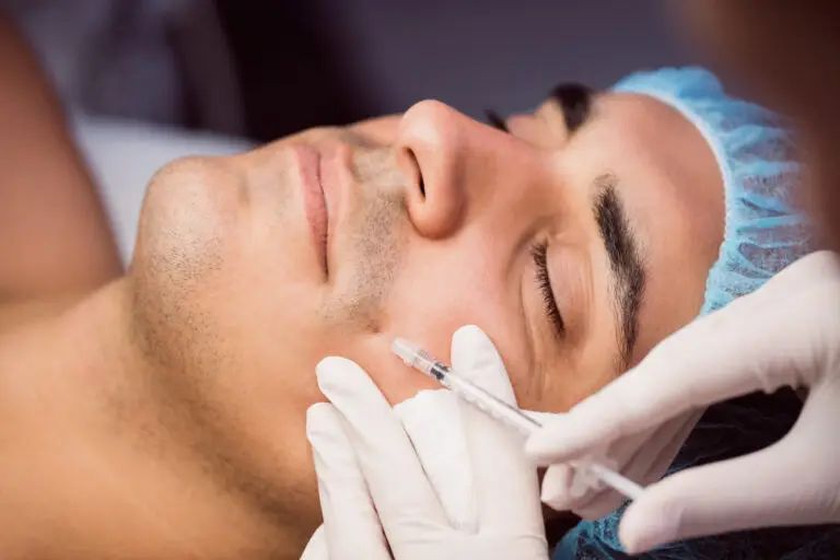 man receiving botox injection in his face
